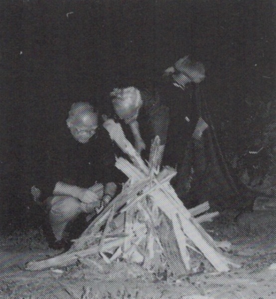 A visitor from Jana Gora lights up a bonfire.